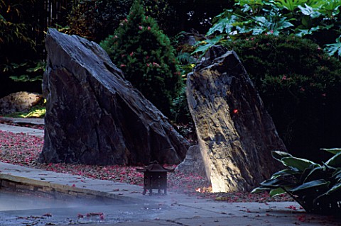 NATURAL_ROCKS_LIT_FROM_BELOW_WITH_RAKED_GRAVEL__STEAMING_POND_THE_ZEN_INSPIRED_GARDEN_DESIGNED_BY_SP