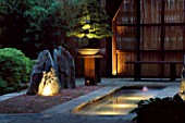 JAPANESE STYLE GARDEN: POND  ROCKS LIT FROM BELOW  PINUS BONSAI & BAMBOO FENCE.THE ZEN INSPIRED GDN. DES: SPIDERGARDEN.COM  LIGHTING: COTSWOLD ELECTRICAL. CHELSEA 2000