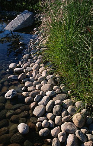 COBBLE_EDGED_POND_IN_MINIMALIST_WATER_GARDEN_DESIGNED_BY_ULF_NORDFJELL__HEDENS_LUSTGARD__SWEDEN
