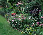 RED GABLES  WORCESTERSHIRE: BORDER FILLED WITH ROSES