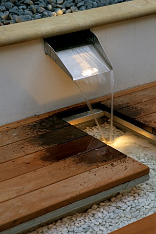 BRUSHED_STAINLESS_STEEL_WATERFALL__RILL_AND_DECKING_DEVELOPMENT_BY_CANDY_BROTHERS_LIGHTING_BY_LIGHTI