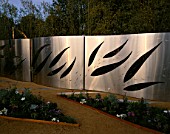 STAINLESS STEEL FENCING WITH LEAF CUT-OUTS  DESIGNED BY PHILIPPE HERLIN AND DANIEL JUD
