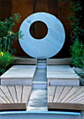 RILL WITH DECKING AND CONCRETE CIRCULAR WATER FEATURE. CIRC GARDEN  CHELSEA 2001  DESIGNER: ANDY STURGEON