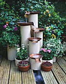 WATER FEATURE MADE FROM RECYCLED HOT WATER CYLINDERS AND GAS MAINS