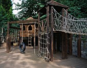 CHILDRENS WOODEN PLAY EQUIPMENT ON DECKING