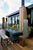 AFRICAN THEMED ROOF TERRACE: SLIDING SKYLIGHT WITH PERIMETER GALVANISED CONTAINERS.  IROKO DECKING.   DESIGN: S. WOODHAMS