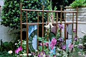 COPPER SCREEN BY STUART JONES WITH STAINED GLASS BY CHARLOTTE MORRISON. CHELSEA 2002/CHLOE WOOD/TAMSIN WOODHOUSE