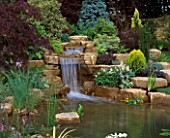 WATERFALL IN GARDEN DESIGNED BY BRIAN AUGHTON AND TERESSA POTTER. PLANTS BY TARLETON SPECIMEN PLANTS