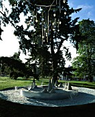 FJORD  BY STEPHEN WOODHAMS: GLASS CHANDELIERS   GLASS CHIPPING CONES AND METAL RINGS. WESTONBIRT FESTIVAL OF GARDENS 2002