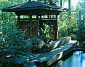 KOI POND AND INDONESIAN GAZEBO IN THE WOODLAND GARDEN. DESIGNERS: ILGA JANSONS AND MIKE DRYFOOS