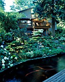 THE HOUSE SEEN FROM THE KOI POND. DESIGNERS: ILGA JANSONS AND MIKE DRYFOOS