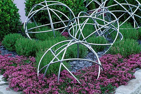 PINK_THYME_WITH_METAL_GLOBES_TATTON_PARK_2002__DESIGNER_MYFANWY_JONES