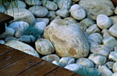 DETAIL OF WHITE BOULDERS  DECKING AND FESTUCA GLAUCA: DESIGN BY ALISON WEAR ASSOCIATES