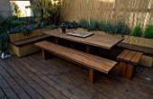 ROOF GARDEN: RED CEDAR BENCH AND TABLE AND BAMBOO FENCE: DESIGN BY ALISON WEAR ASSOCIATES