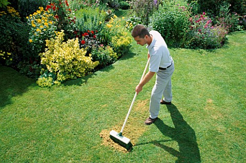 RICHARD_BRUSHES_SAND_INTO_LAWN_NOT_TO_BE_USED_FOR_PACKAGING