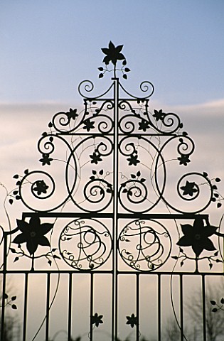 ORNATE_METAL_CLEMATIS_GATES_AT_EASTLEACH_HOUSE__GLOUCESTERSHIRE