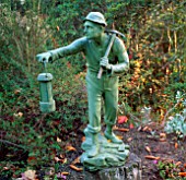 A STATUE OF A MINER DECORATES THE TERRACE AT PYRFORD COURT GARDEN  SURREY