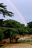THE PRIORY  BEECH HILL  BERKSHIRE: OLD CEDAR TREE WITH WROUGHT IRON GATE INTO THE WALLED GARDEN AND RAINBOW