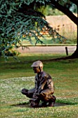 THE PRIORY  BEECH HILL  BERKSHIRE: STATUE OF BOY WICKETKEEPER