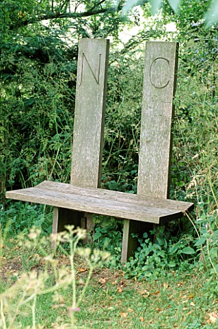 OAK_BENCH_BY_MARY_RAWLINSON_IN_THE_GLADE_AT_FOVANT_HUT__WILTSHIRE