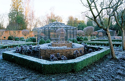 WEST_GREEN_HOUSE_GARDEN__HAMPSHIRE_CLIPPED_BOX_HEDGING_IN_THE_POTAGER_WITH_AN_OLD_METAL_FRUIT_CAGE_I