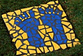 SUNDIAL PROJECT BY CLARE MATTHEWS: MOSAIC PLAQUE WITH IMAGE OF FEET.
