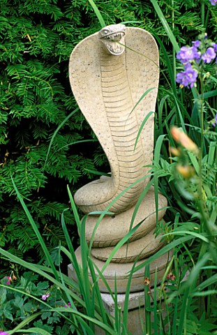 WOODCHIPPINGS__NORTHANTS_STONE_COBRA_FLANKING_THE_YEW_ARCH