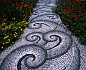 CHELSEA FLOWER SHOW 2004: LIFE GARDEN DESIGNED BY JANE HUDSON AND ERIK DE MAEIJER: DETAIL OF PEBBLE MOSAIC PATH BY MAGGY HOWARTH