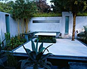 CHELSEA 2004: STEEL AND GLASS GARDEN DESIGNED BY PHILIP NASH DESIGN: MODERN COURTYARD GARDEN WITH WHITE RENDERED WALLS AND EXOTIC PLANTING WITH AGAVE AND BAMBOOS