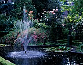 AMSTERDAM: PRIVATE GARDEN WITH FOUNTAIN  POOL AND ROSES
