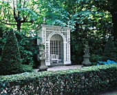 AMSTERDAM: PRIVATE GARDEN - FORMAL GARDEN WITH STATUES AND WHITE TRELLIS ARBOUR