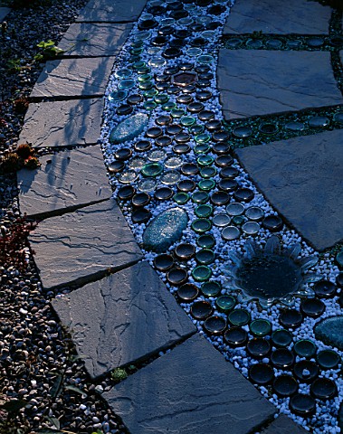 RECYCLED_BOTTLES__PEBBLES__GLASS_ON_CIRCULAR_PAVED_PATH_DESIGNER_DAVID_CHASE