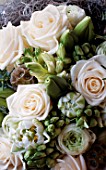 WHITE AND LIME GREEN BOUQUET CONTAINING WHITE ROSES AND BUDDING TULIPS BY THE FLOWERBOX
