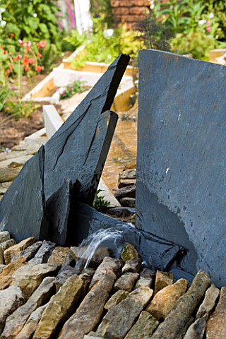 WINGWELL_NURSERY__RUTLAND_WATER_FEATURE_WITH_DRYSTONE_WALL_AND_ANGLED_SLATE