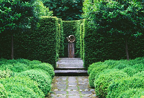 RIDLERS_GARDEN__SWANSEA__WALES_VISTA_ALONG_PATH_TO_FOCAL_POINT_WITH_BOX_BALLS_AND_YEW_HEDGING__DESIG