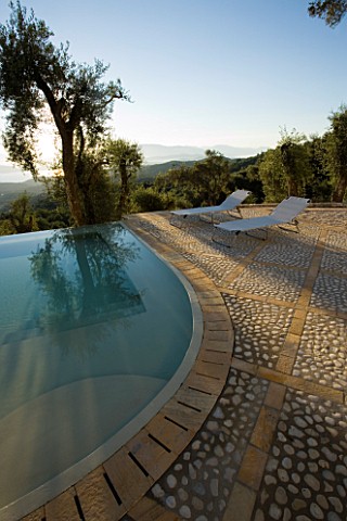 VIEW_OF_THE_ALBANIAN_MOUNTAINS_WITH__OLIVE_TREES_AND_INFINITY_SWIMMING_POOL_IN_THE_FOREGROUND_GINA_P