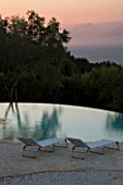 GINA PRICES GARDEN  CORFU: VIEW ACROSS THE INFINITY POOL TO THE IONIAN SEA AND ALBANIAN MOUNTAINS