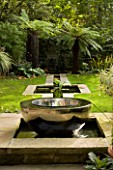 CHALICE SUNDIAL IN POOL BY DAVID HARBER BESIDE RILL WITH LAWN