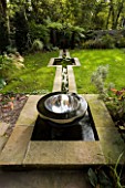 CHALICE SUNDIAL IN POOL BY DAVID HARBER BESIDE RILL WITH LAWN