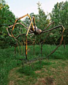 HALL FARM  LINCOLNSHIRE: 10 FOOT METAL SPIDER SEAT BY IAIN TATAM. BENCH