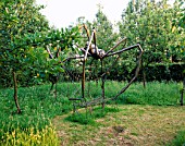 HALL FARM  LINCOLNSHIRE: METAL 10 FOOT HIGH SPIDER SEAT BY IAIN TATAM. BENCH