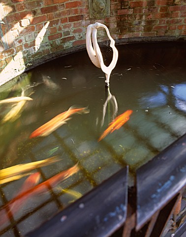 COLD_CAST_WHITE_MARBLE_SCULPTURE_BY_PAM_FOLEY_IN_A_POOL_WITH_KOI_CARP_AT_THE_GALAXIE_HOTEL__OXFORD