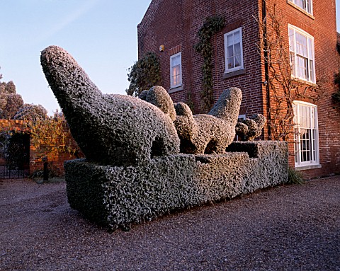 PARSONAGE__WORCESTERSHIRE_FROSTED_TOPIARY_HEDGE_BESIDE_THE_HOUSE_WINTER
