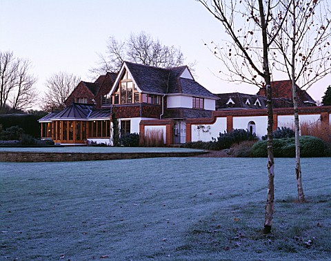 GARDEN_DESIGNED_BY_DUNCAN_HEATHER_THE_HOUSE_SEEN_FROM_ACROSS_THE_FROSTY_LAWN