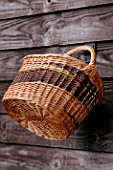 WINDRUSH WILLOW: WILLOW BASKET HANGING UP ON THE BARN DOOR