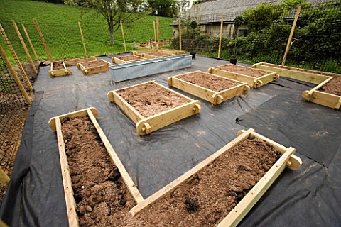 DESIGNER_CLARE_MATTHEWS_THE_POTAGER_BEFORE_GRAVEL_AND_PLANTS_ARE_ADDED