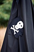 DESIGNER: CLARE MATTHEWS - CHILDRENS PARTY : BLACK PIRATE TENT WITH SKULL AND CROSSBONE