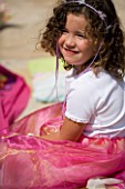 DESIGNER CLARE MATTHEWS: CHILDRENS PARTY - GIRL EATING PICNIC AT PARTY