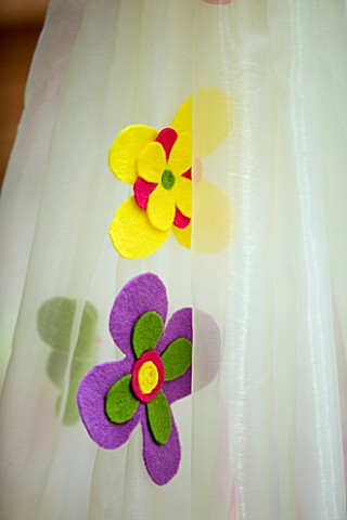 DESIGNER_CLARE_MATTHEWS_CHILDRENS_PARTY__DETAIL_OF_FLOWERS_ON_COCOON