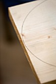 DESIGNER: CLARE MATTHEWS: BENCH AND TABLE PROJECT - CURVE MARKED OUT ON WOOD WITH PLATE
